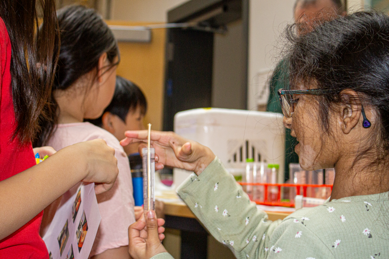 Kids' Tech University students work on hands-on science activity.